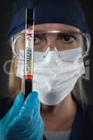 Female Lab Worker Holds Test Tube of Blood Labeled Coronavirus C