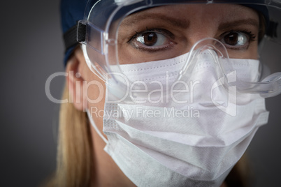 Female Medical Worker Wearing Protective Face Mask and Gear Agai
