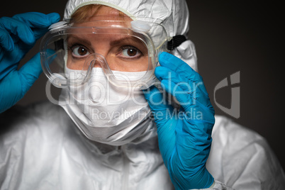 Female Medical Worker Wearing Protective Face Mask and Gear Agai