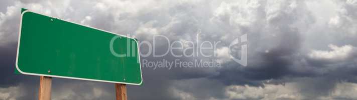 Blank Green Road Sign Against Ominous Cloudy Stormy Sky Backgrou