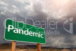 Pandemic Green Road Sign Against Ominous Stormy Cloudy Sky