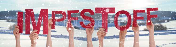 People Hands Holding Word Impfstoff Means Vaccine, Snowy Winter Background