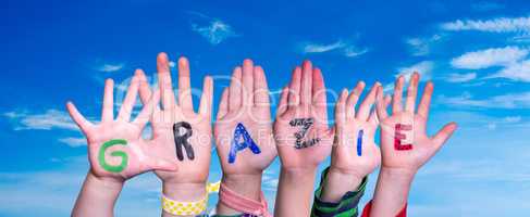 Children Hands Building Word Grazie Means Thank You, Blue Sky