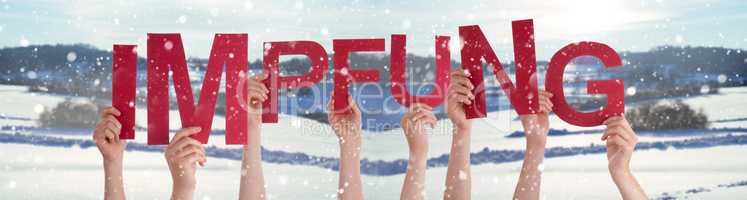 People Hands Holding Word Impfung Means Vaccination, Snowy Winter Background