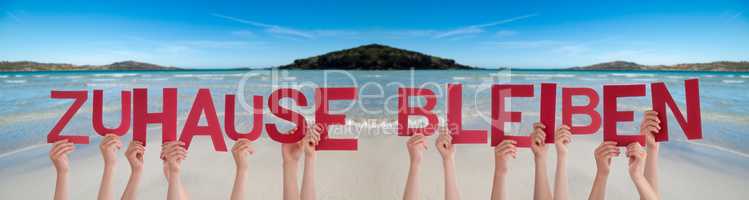 People Hands Holding Word Zuhause Bleiben Means Stay At Home, Ocean Background