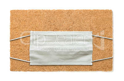 Blank Welcome Mat With Medical Face Mask Isolated on White Amids