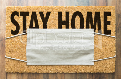 Welcome Mat With Medical Face Mask and Stay Home Text Amidst The