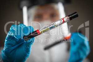 Female Doctor or Nurse Holding Test Tube of Blood Labeled Positi