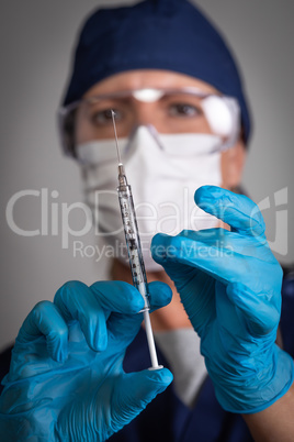 Doctor or Nurse Holding Medical Syringe with Needle