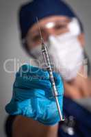 Doctor or Nurse Holding Medical Syringe with Needle