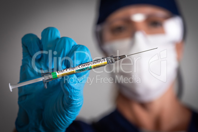 Doctor or Nurse Holding Medical Syringe with Coronavirus COVID-1
