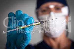 Doctor or Nurse Holding Medical Syringe with Coronavirus COVID-1
