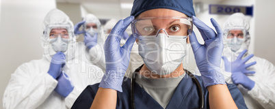 Team of Female and Male Doctors or Nurses Wearing Personal Prote