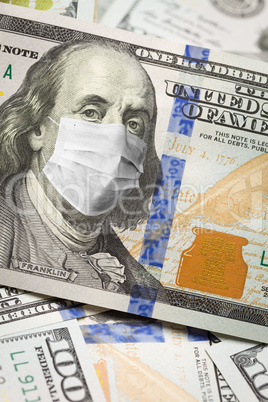 One Hundred Dollar Bill With Medical Face Mask on Face of Benjam