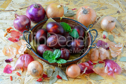 Easter eggs in wicker basket and onion