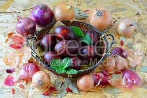 Easter eggs in wicker basket and onion