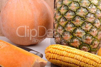 collection of fruit and vegetables. Pineapple, corn, pumpkin, orange