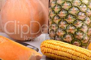collection of fruit and vegetables. Pineapple, corn, pumpkin, orange
