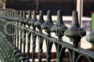 Metal fence. Metal curly fence in the park