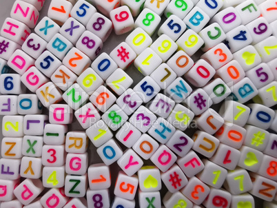 Set of plastic cubes with colored letters and numbers