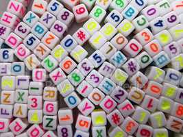 Set of plastic cubes with colored letters and numbers