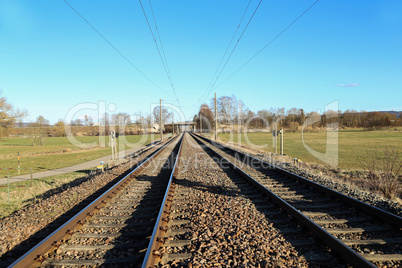 Railway stretching into the distance of fields