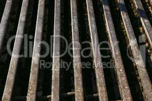 Grill of old rusty rails on a farm