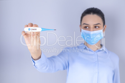 Girl with mask on face check fever