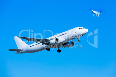 airplane and drone in blue sky