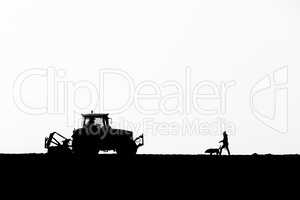 dog walker meets tractor