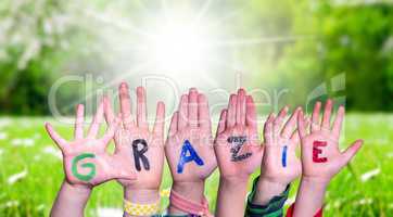 Children Hands Building Word Grazie Means Thank You, Grass Meadow