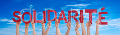 People Hands Holding Word Solidarite Means Solidarity, Blue Sky