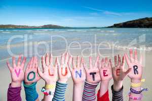 Children Hands Building Word Volunteer, Ocean Background