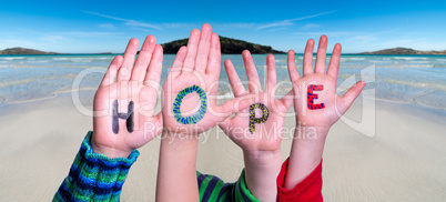 Children Hands Building Word Hope, Ocean Background