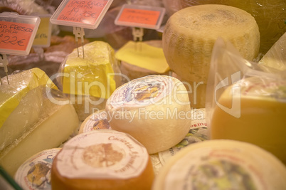 Cheeses on sale on the counter of the grocery store 6