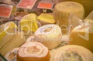 Cheeses on sale on the counter of the grocery store 6