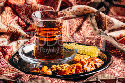Tea in armudu with oriental delights and crystal sugar