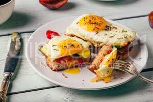 Sandwiches with vegetables and fried egg and cup of coffee