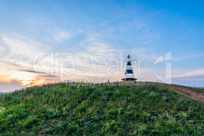 Beacon with the pointer on the hill