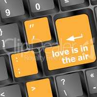 Modern keyboard with love is in the air text