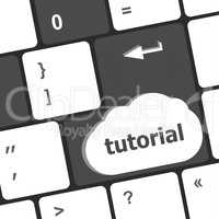 tutorial or e learning concept with key on computer keyboard