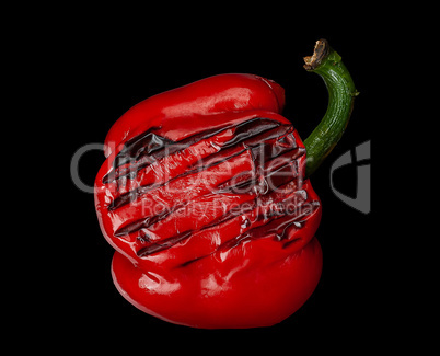 Grilled red pepper on black background