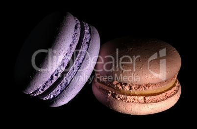 Two macaroons darkened in black