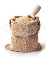 White rice and scoop in sack