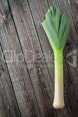 Leek on a wooden background