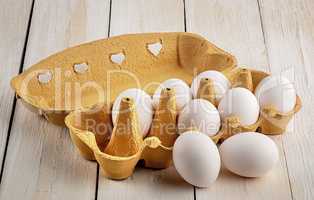 Eggs near the tray on white table