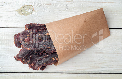 Jerky in a paper bag top view