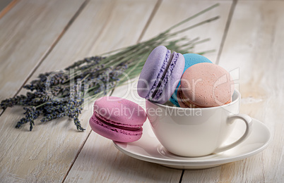 Macaroons in white cup with lavender