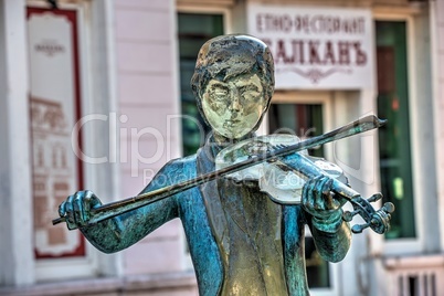 Sculpture of a violinist boy in the city of Ruse in Bulgaria