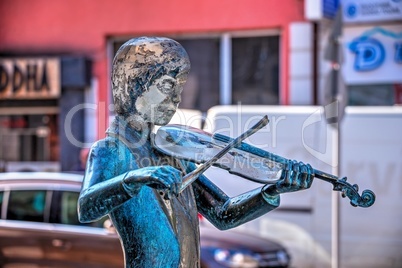 Sculpture of a violinist boy in the city of Ruse in Bulgaria